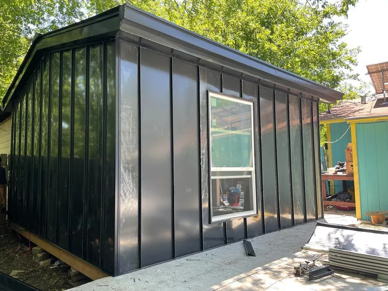 Black standing seam metal wall panels for Roof Inspection in Algonquin